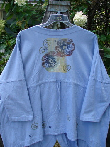 1997 Day Jacket Curl Wind Freesia OSFA featuring vintage buttons, two front pockets, dolman sleeves, V neckline, drop shoulders, rounded front tails, upward scooped back hemline with draw cord, and curl wind theme paint.