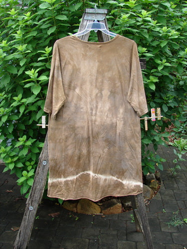 Barclay Tournesol Slim Tunic Moon Rise Mottled Earth OSFA displayed on a swinger, showcasing its loose three-quarter sleeves and unique varying hemline, embodying Bluefishfinder.com's vintage-inspired, creative style.