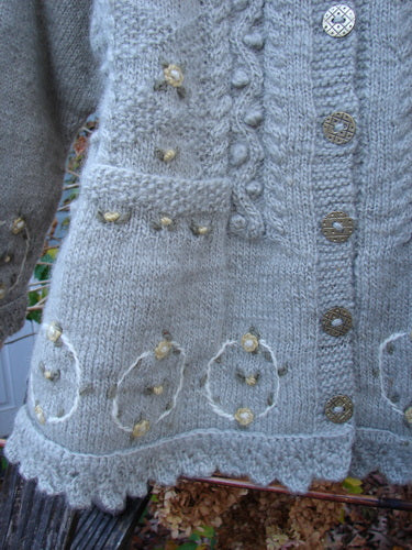 Tara Handknits NWT Kids Wild Smock Sweater Jacket Size Medium, showcasing intricate knit patterns, oversized metal buttons, and a lace-collared neckline, embodying vintage craftsmanship and unique design from Bluefishfinder.com.