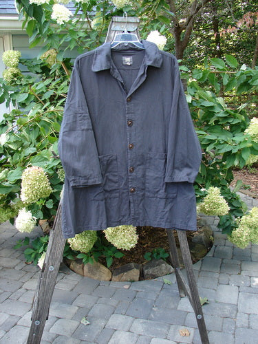 2001 Twill Candy Button Jacket Unpainted Licorice Size 2 displayed on a hanger, showcasing its long sleeves, drop shoulders, large front square pockets, and unique textured vintage buttons.