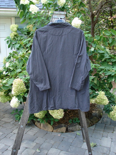 2001 Twill Candy Button Jacket Unpainted Licorice Size 2 displayed on a hanger, highlighting its long sleeves, drop shoulders, two large front pockets, and unique oversized buttons.