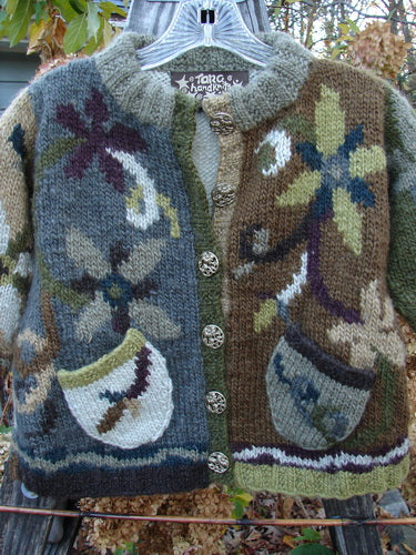 Tara Handknits Kids Smock Cardigan Sweater Coat Size 4-6 featuring vibrant floral patterns and metal buttons, crafted with heavy yarn and ribbed details. Perfectly combines vintage charm and warmth for children.