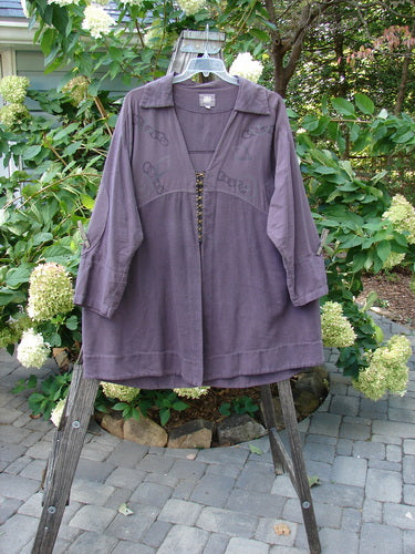 2000 Flannel Fanne Shirt Bubbles Eggplant Size 2 displayed on a swinger, featuring a deep V-neck, flannel and canvas patterns, and a sweet flannel shirt-style collar.