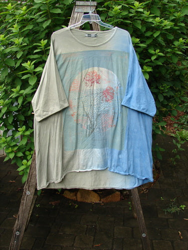 Barclay Art Tee Double Moon Blossom in Mottled Blue Dusk features a tunic length, drop shoulders, and three-quarter sleeves, embodying BlueFishFinder's vintage style in organic cotton.