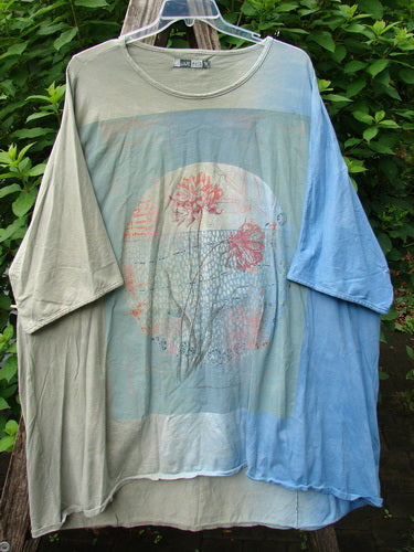 Barclay Art Tee Double Moon Blossom Mottled Blue Dusk OSFA, featuring a loose, three-quarter sleeve tunic with a rounded neckline, drop shoulders, and unique hemline, showcasing the Double Moon Blossom design.