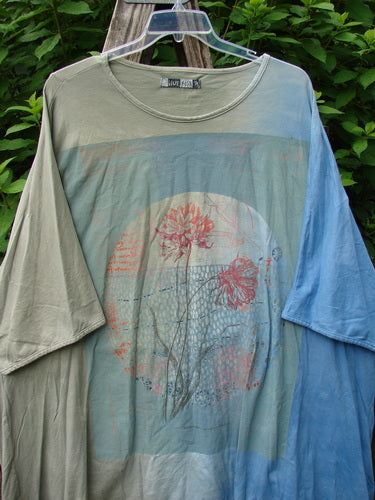 Barclay Art Tee Double Moon Blossom Mottled Blue Dusk OSFA features a longer tunic length, loose three-quarter sleeves, and rounded neckline, highlighting the unique double moon blossom design in fine organic cotton.