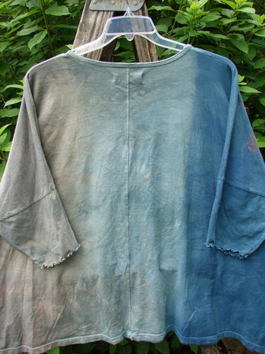 Barclay Dolman Curl Edge Square Pullover features a seamless, boxy design with a ribbed neckline and curly lower arm edgings, displayed on a rack, reflecting Bluefishfinder.com's unique, vintage-inspired style.