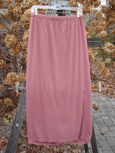 1994 Gather Skirt Unpainted Gourd Size 1: A pink skirt with sectional panels and a replaced elastic waistband. Can be worn gathered in the front or back for varying lengths.