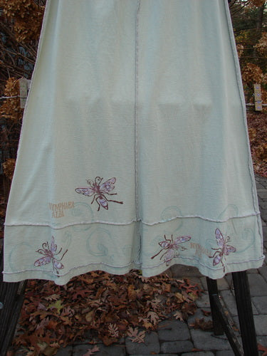 Image alt text: "1998 Botanicals Sparrow Skirt with butterflies, in Grasshopper, size 1, made from organic cotton, full elastic waist, exterior stitchery, lower horizontal sectional panels, wide A-line flare, adorned in classic botanicals theme paint, waist 28-38, hip 46, sweep 90, length 38"