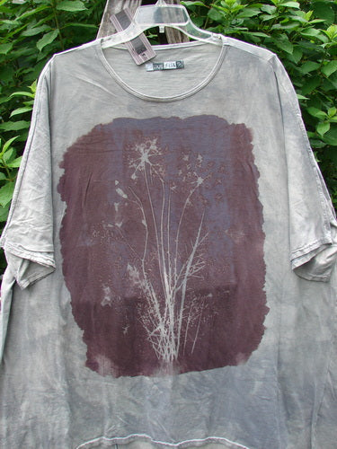 Barclay NWT Art Tee Floral Reach Raincloud Grey OSFA features a plant design, longer tunic length, drop shoulders, loose three-quarter sleeves, and a rounded neckline, embodying BlueFishFinder's vintage creative expression.