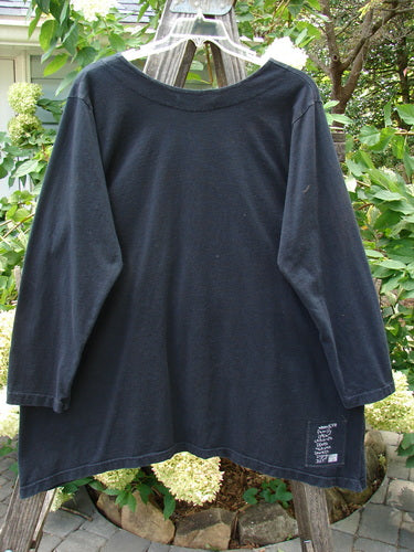 1998 Pocket Top Lace Up Celtic Infinity Black Size 1 on a wooden hanger, showcasing an A-line shape with a varying hemline, long lace-up neckline, and a triangular front pocket with Celtic designs.