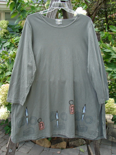 2001 Market Top Junk Drawer Inkpod Size 2, featuring a grey shirt with a large A-line shape, drop shoulders, vented sides, and a unique junk drawer theme drawing, from the 2001 Spring Collection.