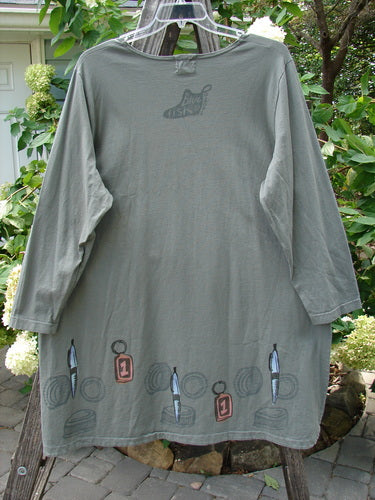 2001 Market Top Junk Drawer Inkpod Size 2: Grey shirt with a large A-line shape, drop shoulders, vented sides, and a colorful junk drawer theme painting on organic cotton.