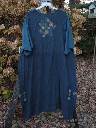 Barclay Linen Cotton Sleeve Long Urchin Dress on clothes rack, with unique structural design details.