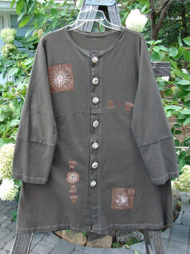 1997 Sample Spring Day Jacket Flower Pot Briquette Size 1, featuring long sleeves, knotted buttons, paneled lower sleeves, and a sweeping swing skirt with contrasting stitchery.