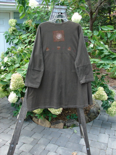 1997 Sample Spring Day Jacket Flower Pot Briquette Size 1 displayed on a swinger, showcasing paneled lower sleeves, matched knotted buttons, and a varying hem with contrasting stitchery.