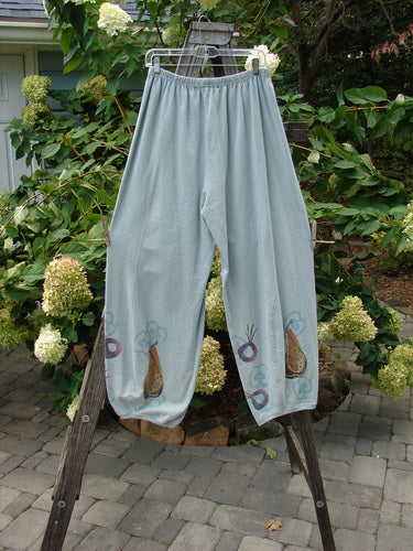 1998 Heavy Radish Pant Bountiful Harvest Birdsong Size 2 displayed on a wooden rack, showcasing its unique vertical sectional S-shaped panels and bottom elastic accents.