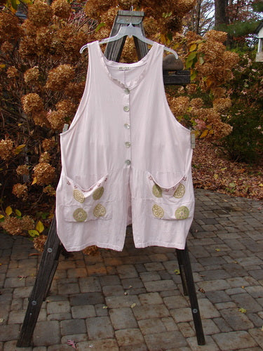 Barclay Shell Button Drop Pocket Vest in Pink Tile, size 2 ai, on a clothes rack.