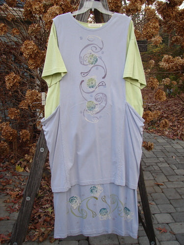 1997 Tunic Dress Curly Garden Dawn Mellon Size 1: Long dress on a rack, close-up of dress, wood post, and wallpaper. Clothing, outdoor, pattern.