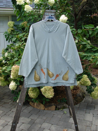 1998 Heavy Crossover V-Neck Bountiful Harvest Birdsong Size 2 displayed on a hanger, featuring a ribbed V-neckline, shirttail hemline, and vegetable-themed designs.