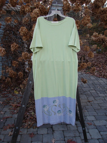 1997 Tunic Dress Curly Garden Dawn Mellon Size 1: A green and purple dress with a longer, straight shape, shallow rounded neckline, and curly garden theme paint.