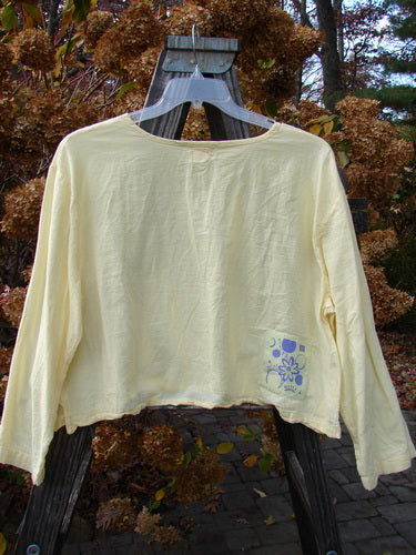 1999 PMU Batiste Boxy Top in Buttercup, Size 2: A yellow shirt on a swinger with long billowy sleeves and a wider boxy shape. Made from cotton batiste, this light and airy top is perfect for summer.