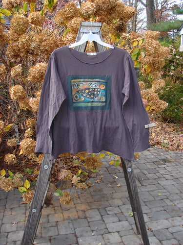 Barclay Batiste Long Sleeved Tee with Love Dove Patch on a swinger. Size 2.