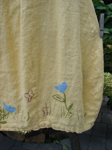 1999 Windy Day Skirt Tulip Buttercup Size 2: Yellow handkerchief linen skirt with blue flowers and butterflies, featuring a full elastic waistline, reverse bell shape, and vertical pleats, perfect for spring mix and match.