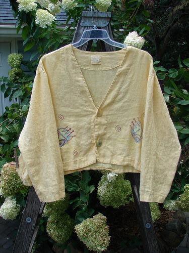 1999 Weathervane Jacket Crown Buttercup Size 2 displayed on a swinger, showcasing unique front mix-match buttons, a top porcelain button, a varying inward rounded side hem, and tulip-themed paint.