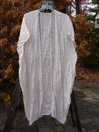 Magnolia Pearl European Cotton Embroidered Lace Duster in Antique White, OSFA - Open flowing white dress with cap drop sleeves and gathered lace seams.
