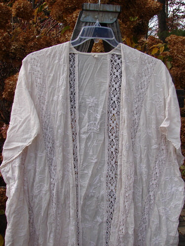 Magnolia Pearl European Cotton Embroidered Lace Duster, antique white, open flowing front, cap drop sleeves, gathered lace seams, matching lace hem, embroidered floral vine back drop, MP rear neckline tag. Bust 66, waist 66, hips 66, sweep 70, front back length 46, sides 50.