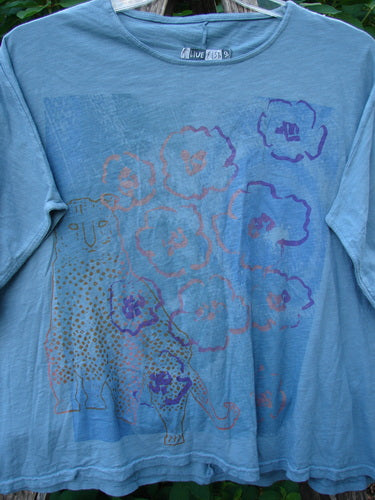 Barclay Cotton Slub Cricket Cap Sleeve Tee Camo Cat Light Teal OSFA featuring a cat and flowers design, cool cap sleeves, a seamless shoulder, and a rounded hemline, reflecting BlueFishFinder's creative vintage style.