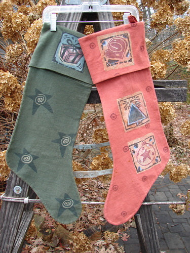 1995 Reprocessed Holiday Sock Duo with Blue Fish Paint, Hollyberry & Green Tea, OSFA: A pair of stockings featuring a red sock with a stained toe and a green sock with stars and spirals. Vintage collectables for the fisher who has it all!
