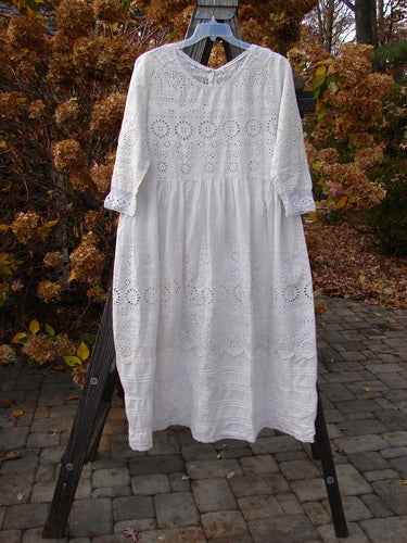 Magnolia Pearl European Cotton Eyelet Lucienne Dress, antique white, on a swinger, with lace details.