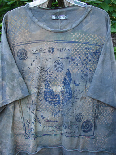 Barclay Raw Edge Flutter Collar High Low Top Blue Fish Love Mottled Steel OSFA featuring a sun and clouds pattern, short raw edge dolman sleeves, and a vertical rear center seam.