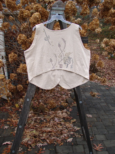 1995 Folk Vest with ceramic buttons, tuxedo front hemline, and sun star theme paint. Made from organic cotton. Size 2.