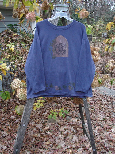 1993 Long Sleeved Tee Center Lotus Flower Medallion Indigo OSFA displayed on a hanger, showcasing its unique boxy shape, wide rib neckline, and vintage lotus flower medallion design.