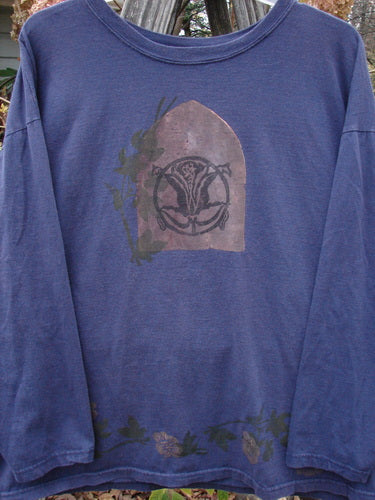 1993 Long Sleeved Tee Center Lotus Flower Medallion Indigo OSFA, featuring a vintage lotus flower medallion graphic on a blue long-sleeved cotton jersey, with a wider rib neckline and distinct boxy shape.