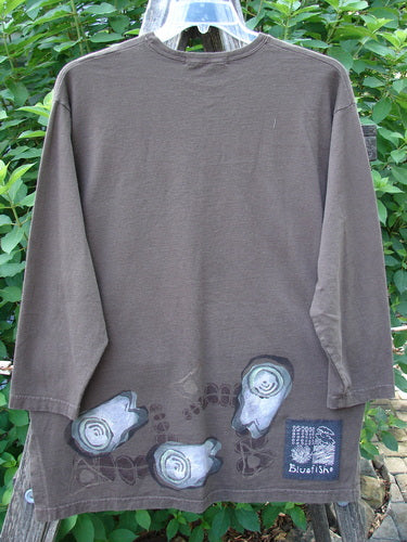 1998 Long Sleeved Vented Tee Tumble Stone Stick Size 1, showcasing a thicker rib neckline, drop shoulders, and unique shirttail hem with vented sides, exemplifying vintage Blue Fish style.