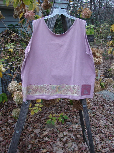 1992 Oversized Tank Continuous Rose Amethyst OSFA displayed on a wooden ladder, highlighting its wide boxy shape and deeper arm openings, with a delicate rose border design visible.