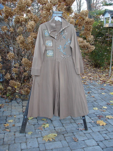 1995 Virginia Woolf Dress Home Butterfly Size 1: Sweeping brown coat with ribbed accents, front snaps, and a tall fold-over turtleneck.