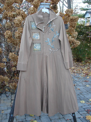 1995 Virginia Woolf Dress Home Butterfly Size 1: Ribbed brown coat with blue and white designs, long hemline, tall fold-over turtleneck, and front snap closures.