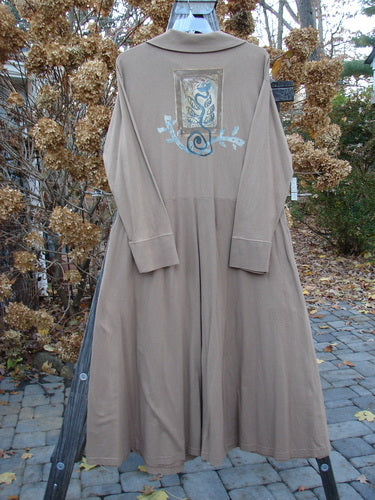 1995 Virginia Woolf Dress with snake and blue design, button detail, and long coat.