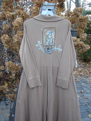 1995 Virginia Woolf Dress Home Butterfly Size 1: Long brown coat on a rack, grey shirt, metal object, blue swirly design, blue and grey painted surface, blue snake, brick walkway.