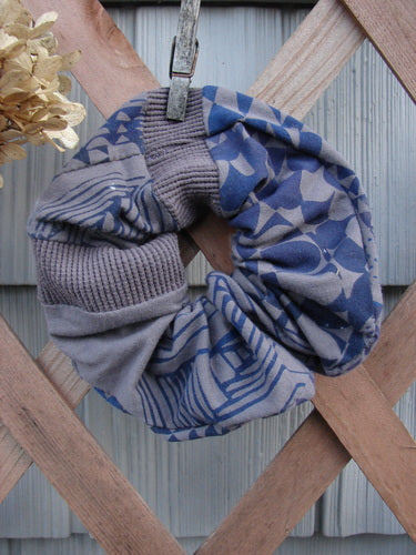 Barclay PMU Cotton Lycra & Thermal Hair Scrunchie Diamond Grid Brum Extra Large, displayed on a wooden fence with a clothespin, showcasing its ruffled fabric and detailed craftsmanship.