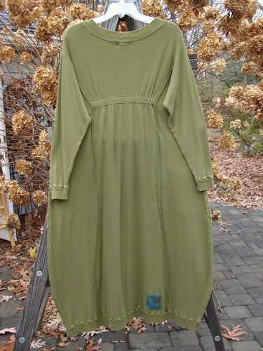 Barclay Patched Thermal Curve Dress Greenroot Size 1: A unique figure-eight shape dress in green. Features include a thicker rib neckline, exterior stitchery, and double rib top exterior pockets.