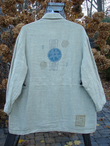 1999 Hemp Yard Coat Far East Cement Size 1: Heavyweight cotton hemp outer with soft flannel lining. Metal buttons, adjustable side tabs, painted pockets. Bust 52, Waist 52, Hips 56, Length 34.