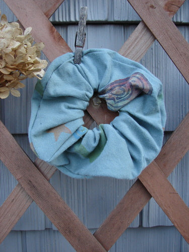 1996 PMU Organic Cotton Hair Scrunchie Abstract Mirror Extra Large displayed on a wooden fence, showcasing its ruffled texture and vintage-inspired design.