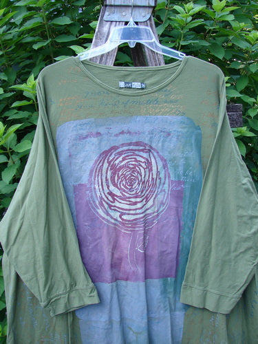 Barclay Art Tee Rose Script Mottled Peapod OSFA displayed on a hanger, highlighting its tunic length, drop shoulders, and loose three-quarter sleeves, embodying the creative freedom of BlueFishFinder.com.