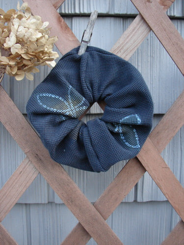 1999 PMU Thermal Hair Scrunchie Lucky Leaf Black Extra Large, showcasing a ruffled fabric with a butterfly design, highlighting its vintage-inspired, sustainably crafted nature from Bluefishfinder.com.